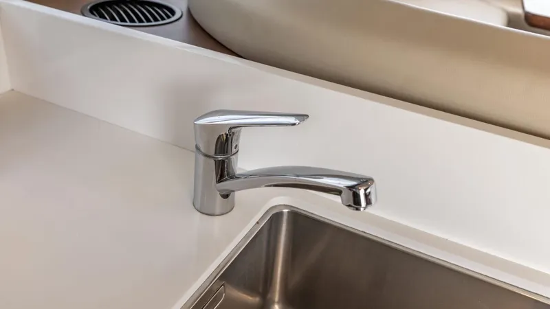  Yacht Photos Pics Modern kitchen sink and faucet on 2019 Princess F45 yacht.