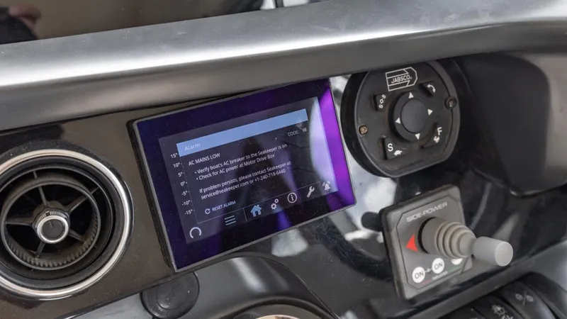  Yacht Photos Pics Control panel of a 2019 Princess F45 yacht with touchscreen and joystick.