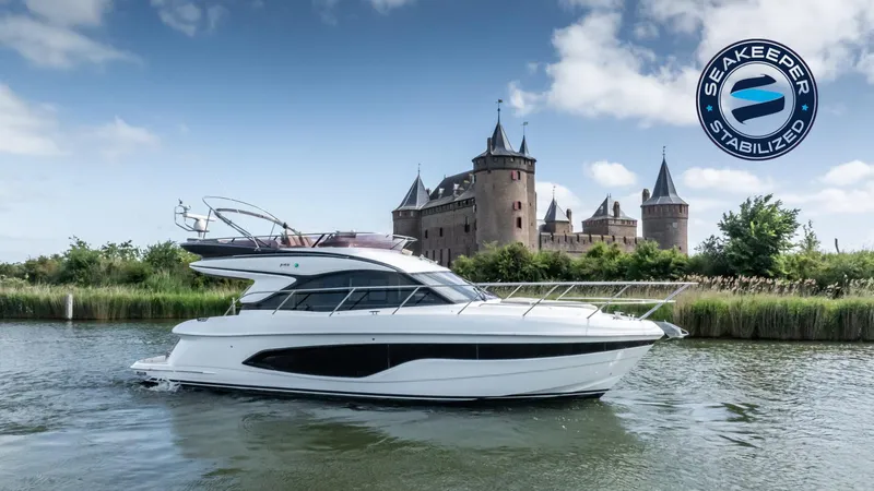  Yacht Photos Pics 2019 Princess F45 yacht cruising near a castle, featuring Seakeeper stabilization.
