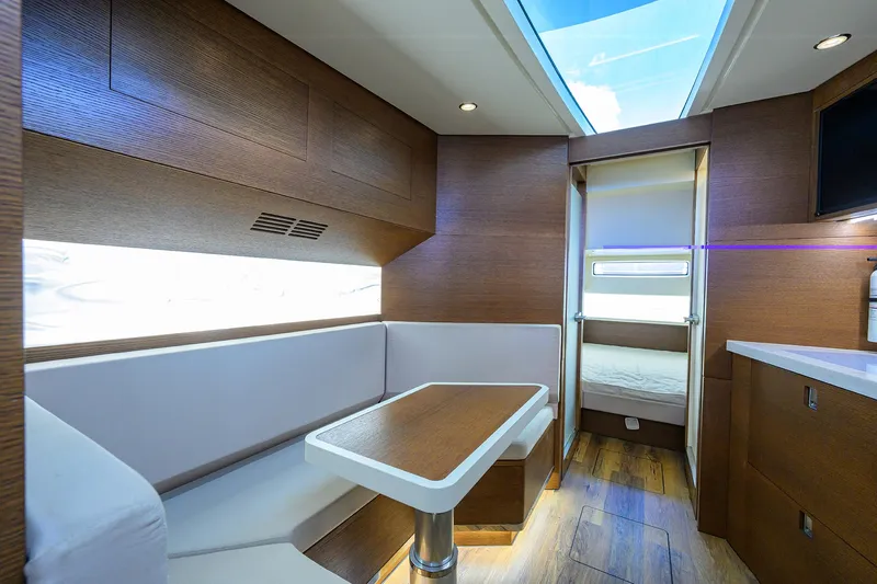 53 Scout Yacht Photos Pics Luxurious interior of 2021 Scout 530 LXF yacht with modern seating and wood finishes.