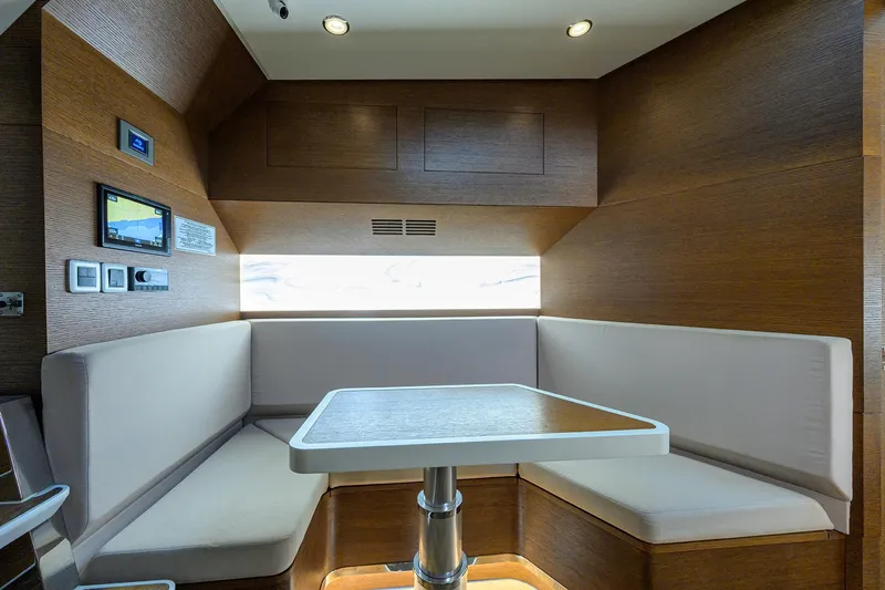 53 Scout Yacht Photos Pics Interior of 2021 Scout 530 LXF yacht with modern seating and table.