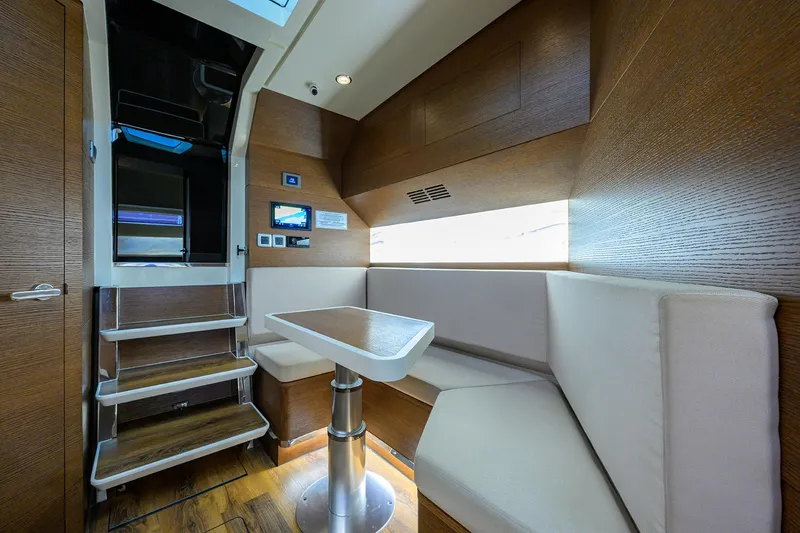 53 Scout Yacht Photos Pics 2021 Scout 530 LXF interior with modern seating and wooden accents.