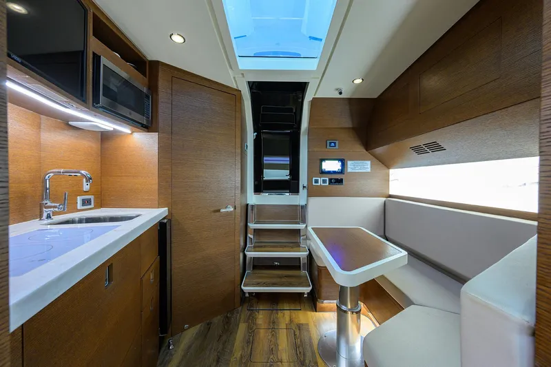 53 Scout Yacht Photos Pics Luxurious interior of 2021 Scout 530 LXF yacht with modern kitchen and seating area.