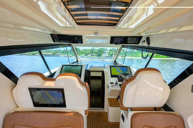 53 Scout Yacht Photos Pics Interior view of 2021 Scout 530 LXF boat cockpit with advanced navigation systems.
