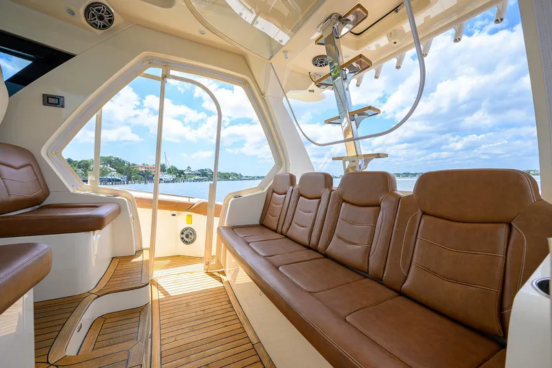 53 Scout Yacht Photos Pics Luxurious interior of 2021 Scout 530 LXF boat with brown leather seating and scenic view.
