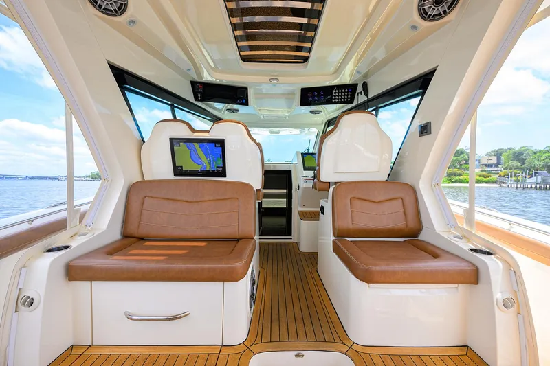 53 Scout Yacht Photos Pics Luxurious interior of 2021 Scout 530 LXF boat with leather seating and navigation display.