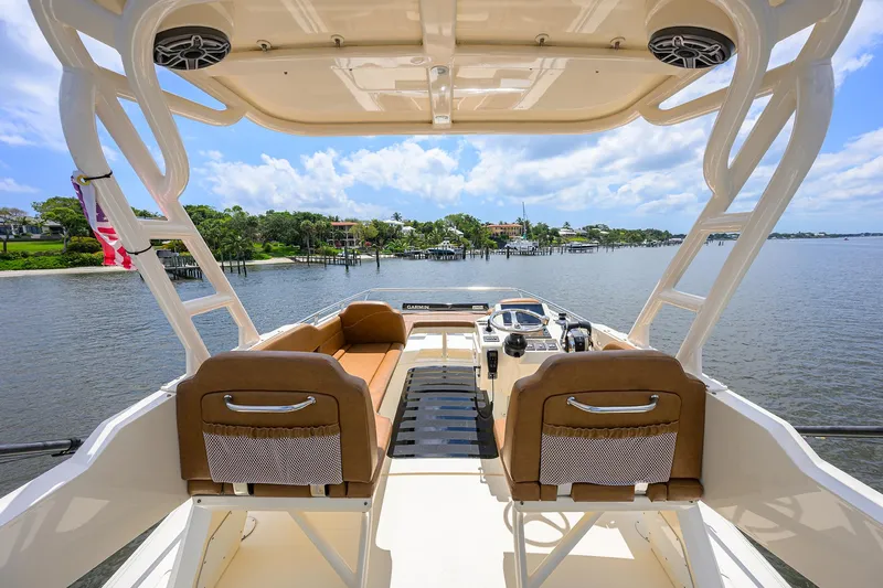 53 Scout Yacht Photos Pics 2021 Scout 530 LXF boat interior with seating, overlooking serene waterfront view.
