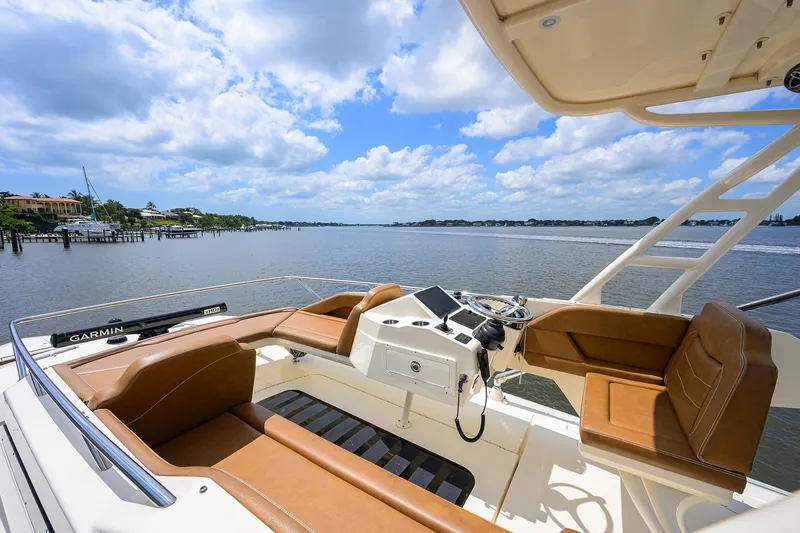 53 Scout Yacht Photos Pics 2021 Scout 530 LXF boat interior with luxurious seating and scenic water view.