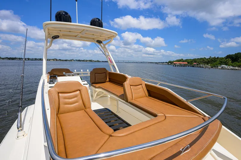 53 Scout Yacht Photos Pics 2021 Scout 530 LXF luxury boat with tan seating on a sunny day.