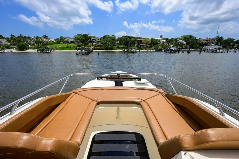 53 Scout Yacht Photos Pics 2021 Scout 530 LXF boat with luxurious seating, cruising on a scenic waterway.