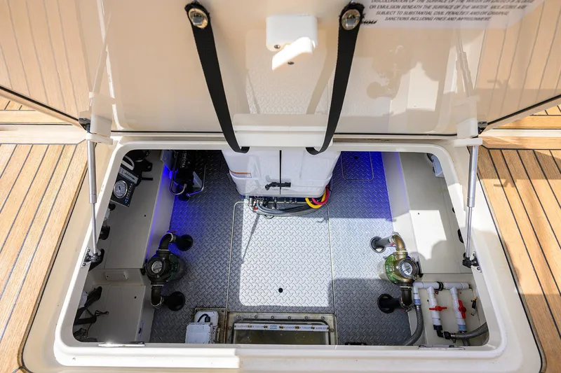 53 Scout Yacht Photos Pics 2021 Scout 530 LXF engine compartment with advanced mechanical systems and wiring.