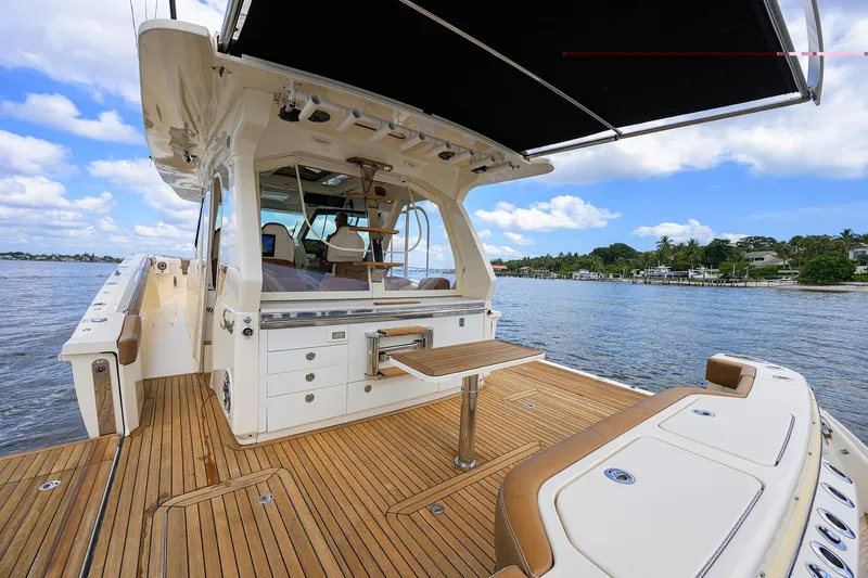 53 Scout Yacht Photos Pics 2021 Scout 530 LXF luxury yacht with teak deck, spacious seating, and scenic water view.