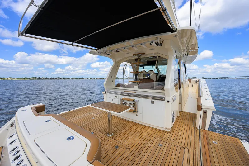 53 Scout Yacht Photos Pics 2021 Scout 530 LXF yacht with teak deck, open sea view, and luxurious seating.