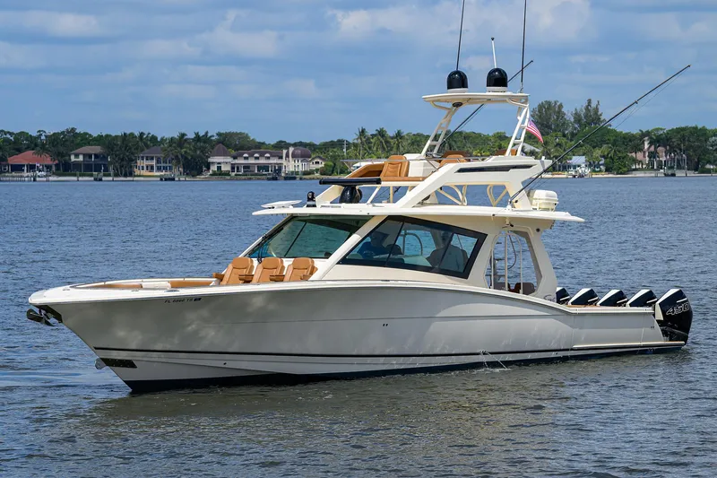 53 Scout Yacht Photos Pics 2021 Scout 530 LXF luxury boat on calm water with scenic background.