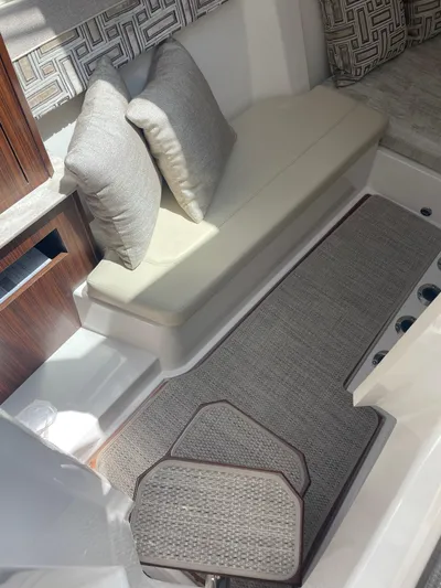  Yacht Photos Pics 2023 Pursuit DC 365 Dual Console interior with cushioned seating and elegant design.