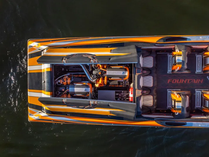  Yacht Photos Pics Aerial view of 2020 Fountain 47 Lightning speedboat with vibrant orange and black design.
