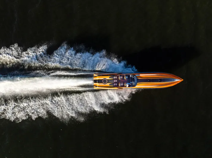  Yacht Photos Pics Aerial view of 2020 Fountain 47 Lightning speedboat racing on water.
