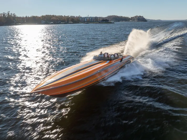  Yacht Photos Pics 2020 Fountain 47 Lightning speedboat racing on open water, creating a dynamic wake.
