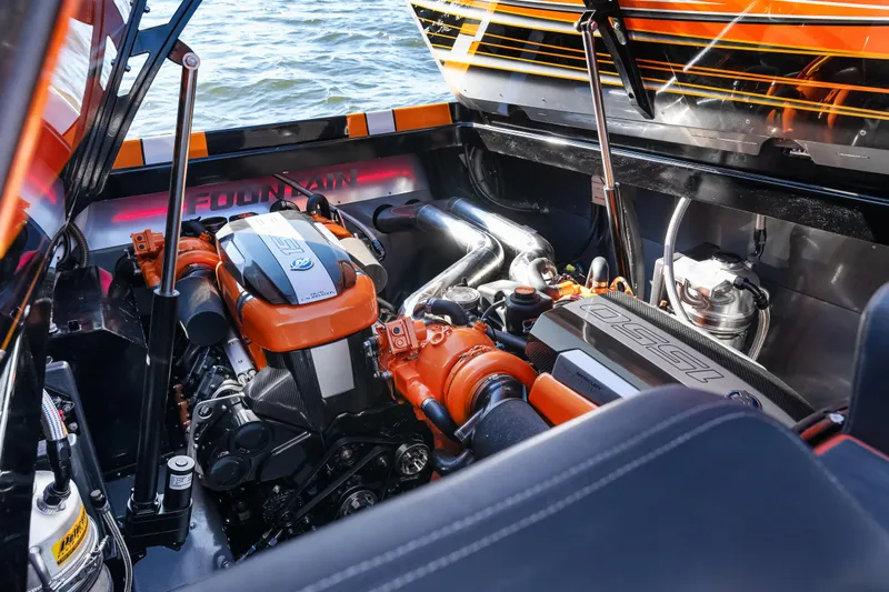  Yacht Photos Pics 2020 Fountain 47 Lightning engine compartment with vibrant orange accents.