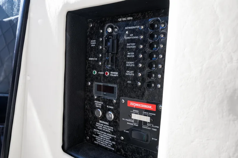  Yacht Photos Pics Control panel of 2020 Fountain 47 Lightning boat with various switches and indicators.