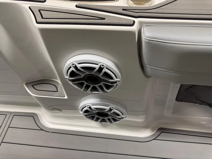  Yacht Photos Pics 2024 Nor-Tech 390 Sport Center Console interior with speakers and cushioned seating.