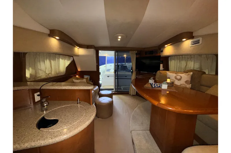 Bellissimo Yacht Photos Pics Interior of 2006 Silverton 38 Sport Bridge yacht with elegant seating and modern amenities.