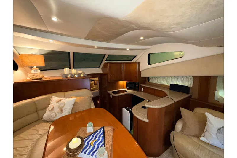 Bellissimo Yacht Photos Pics Luxurious interior of 2006 Silverton 38 Sport Bridge yacht with cozy seating and modern amenities.