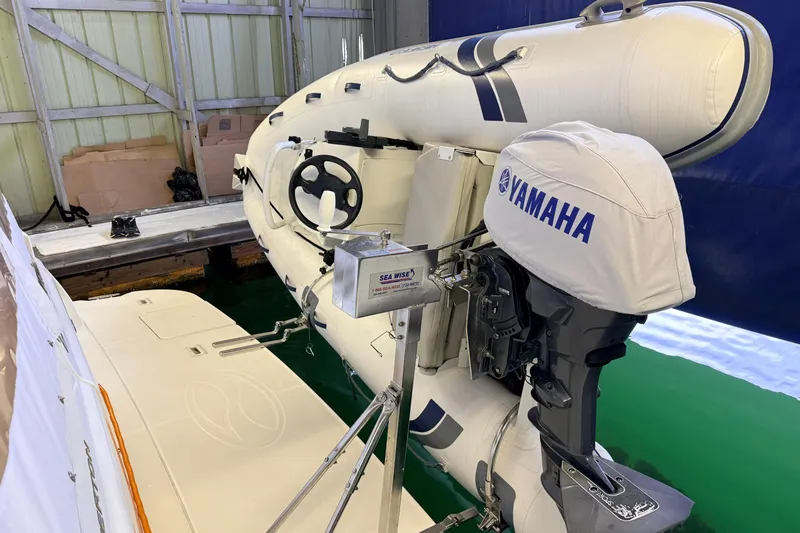 Bellissimo Yacht Photos Pics 2006 Silverton 38 Sport Bridge with Yamaha outboard motor and inflatable boat in dock.