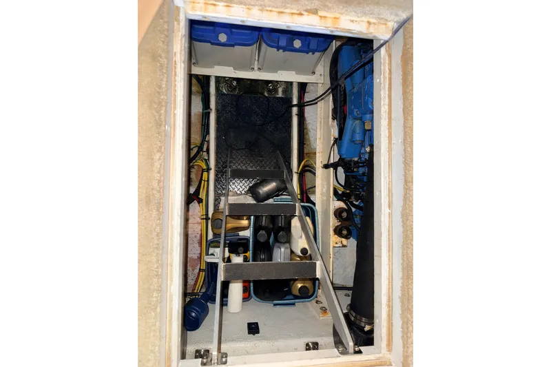 Bellissimo Yacht Photos Pics Engine compartment of a 2006 Silverton 38 Sport Bridge, showcasing mechanical components.