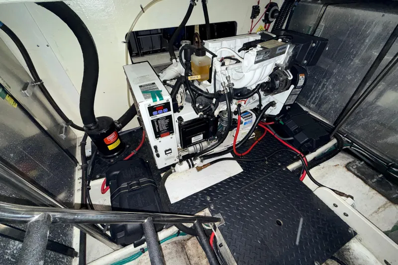 Bellissimo Yacht Photos Pics Engine room of 2006 Silverton 38 Sport Bridge with visible machinery and wiring.