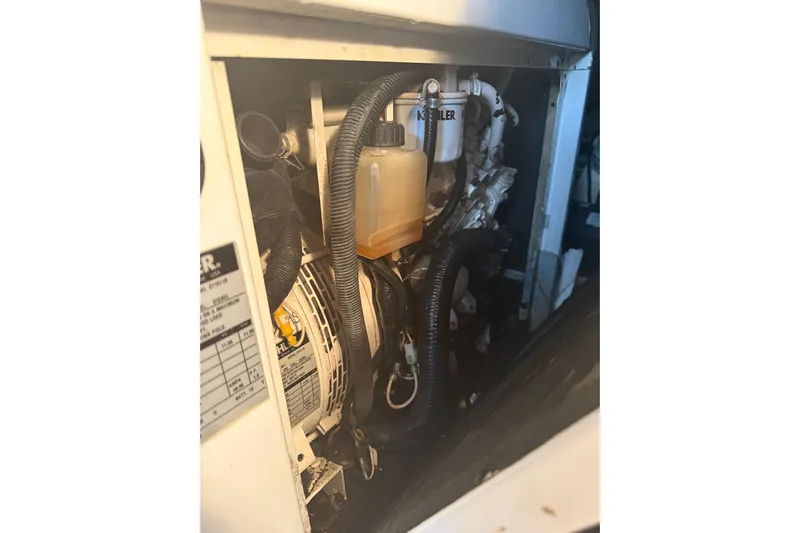 Seaya II Yacht Photos Pics Engine compartment of 2008 Sunseeker Manhattan 50 yacht, featuring mechanical components and hoses.