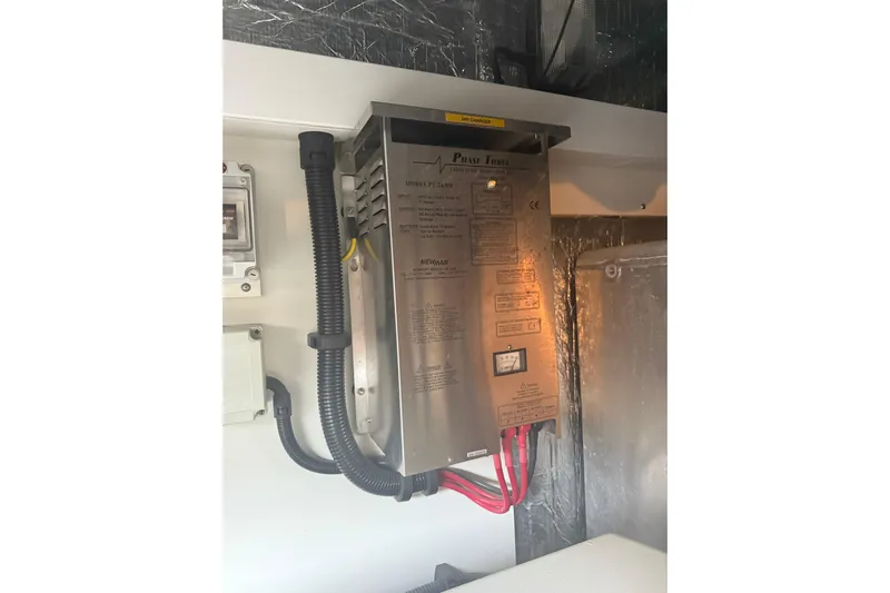 Seaya II Yacht Photos Pics Electrical panel inside 2008 Sunseeker Manhattan 50 yacht, featuring wiring and controls.