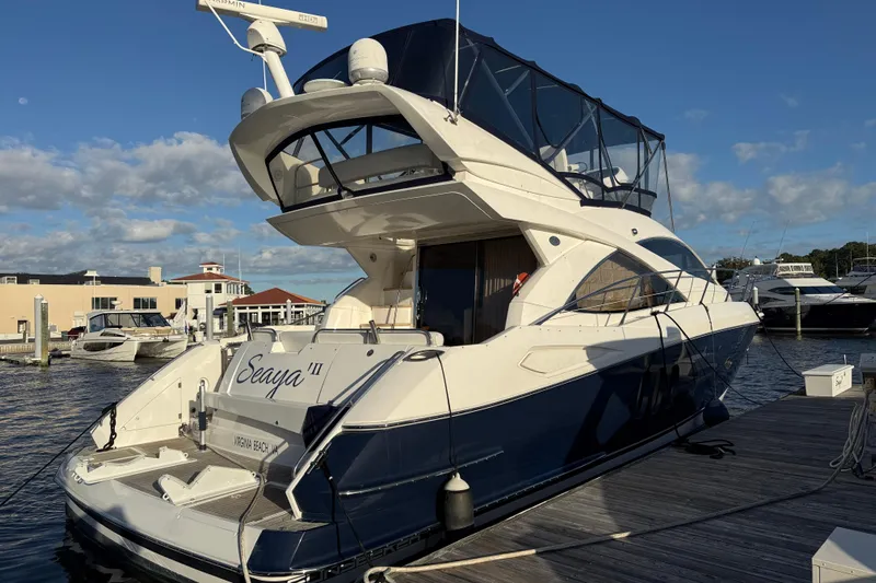 Seaya II Yacht Photos Pics 2008 Sunseeker Manhattan 50 yacht docked at marina under clear sky.