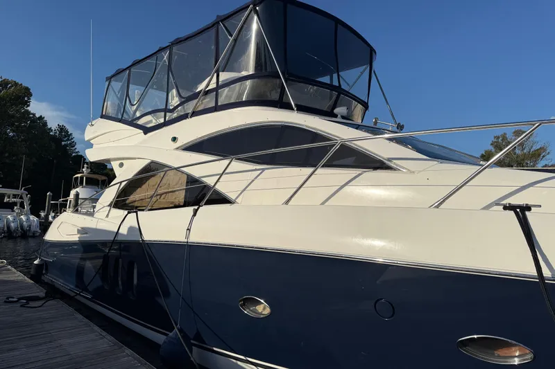 Seaya II Yacht Photos Pics 2008 Sunseeker Manhattan 50 yacht docked, featuring sleek design and spacious upper deck.