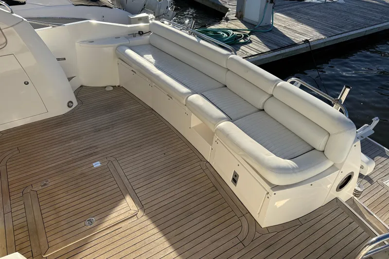 Seaya II Yacht Photos Pics Luxurious Sunseeker Manhattan 50 yacht deck with white seating, 2008 model.