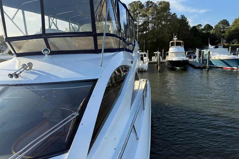 Seaya II Yacht Photos Pics 2008 Sunseeker Manhattan 50 yacht docked at marina, surrounded by other boats.