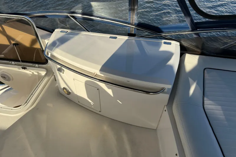 Seaya II Yacht Photos Pics 2008 Sunseeker Manhattan 50 yacht interior with seating and storage, overlooking water.