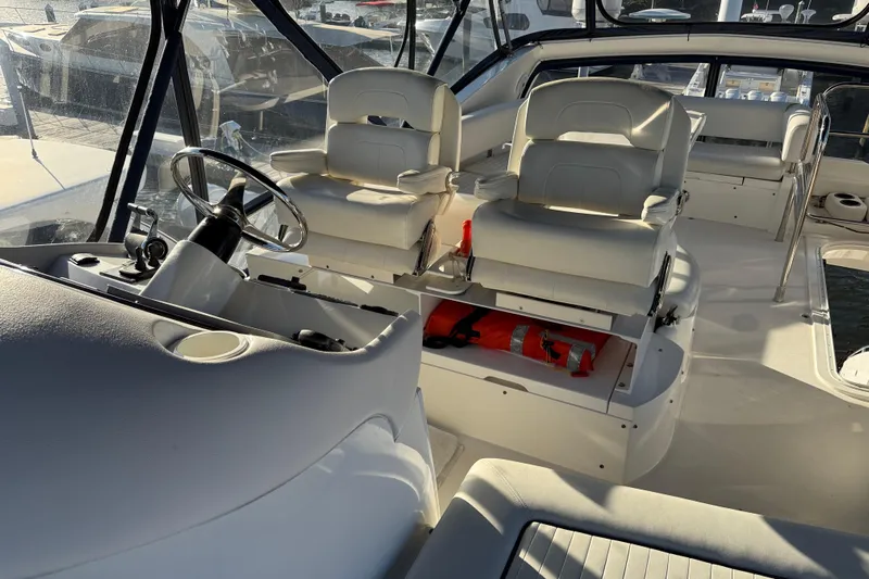 Seaya II Yacht Photos Pics Interior view of 2008 Sunseeker Manhattan 50 yacht with helm and seating area.