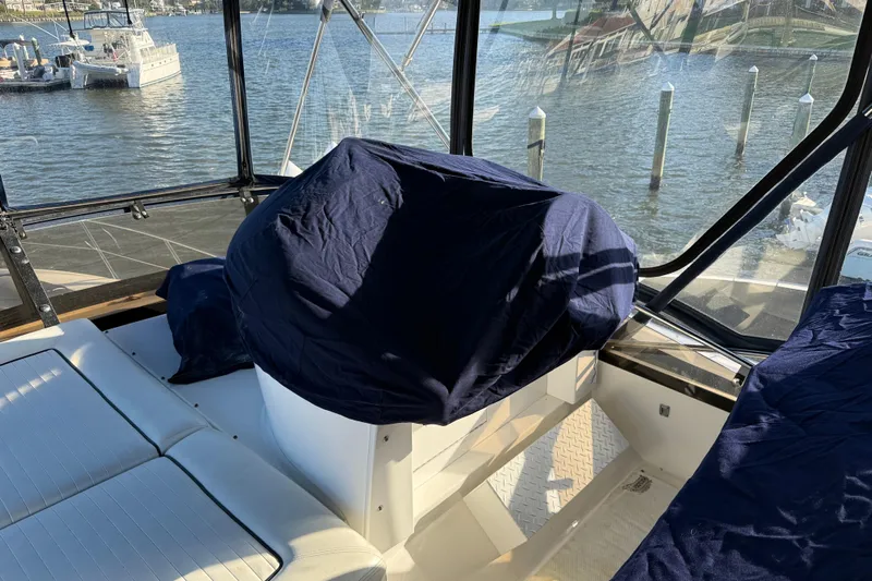 Seaya II Yacht Photos Pics Interior of 2008 Sunseeker Manhattan 50 yacht with covered seating and water view.