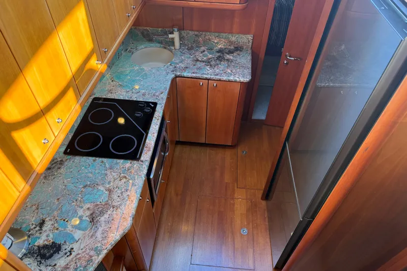 Seaya II Yacht Photos Pics Luxurious kitchen interior of 2008 Sunseeker Manhattan 50 yacht with modern appliances.