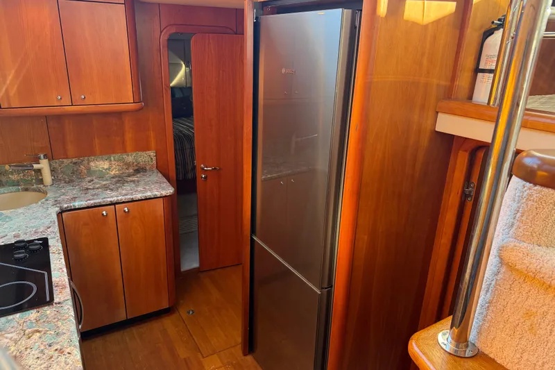 Seaya II Yacht Photos Pics Luxurious 2008 Sunseeker Manhattan 50 yacht interior with modern kitchen and wood finishes.