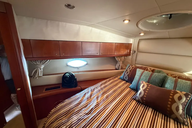 Seaya II Yacht Photos Pics Luxurious cabin interior of 2008 Sunseeker Manhattan 50 yacht with striped bedding.