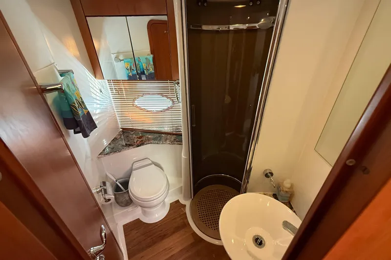 Seaya II Yacht Photos Pics Luxurious bathroom in 2008 Sunseeker Manhattan 50 yacht with modern fixtures and wood accents.