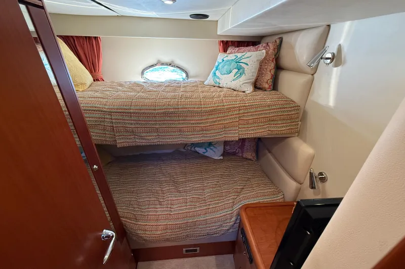 Seaya II Yacht Photos Pics Cozy bunk beds in 2008 Sunseeker Manhattan 50 yacht cabin with nautical decor.