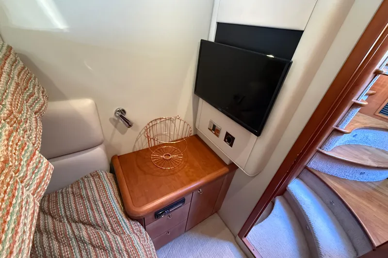 Seaya II Yacht Photos Pics Interior of 2008 Sunseeker Manhattan 50 yacht with TV and wooden cabinet.