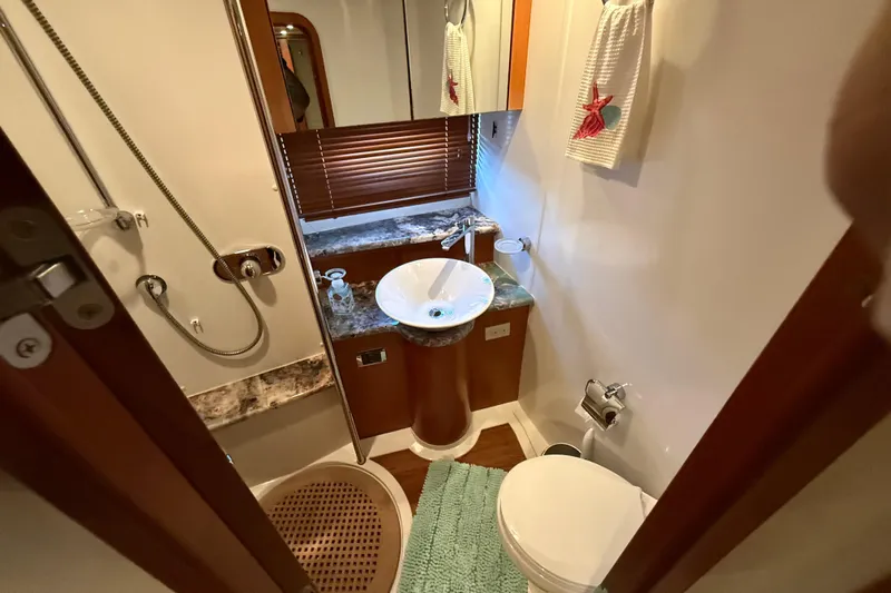 Seaya II Yacht Photos Pics Luxurious bathroom in 2008 Sunseeker Manhattan 50 yacht with modern fixtures and elegant design.