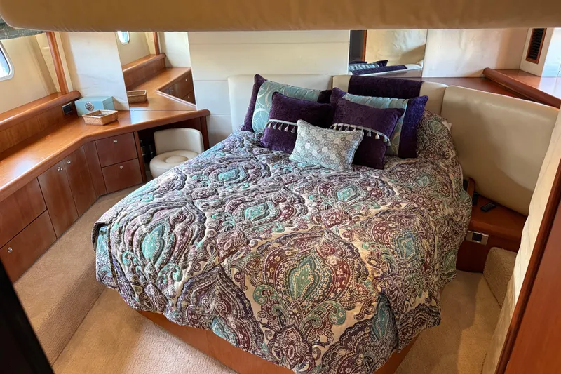 Seaya II Yacht Photos Pics Luxurious bedroom interior of 2008 Sunseeker Manhattan 50 yacht with elegant bedding.