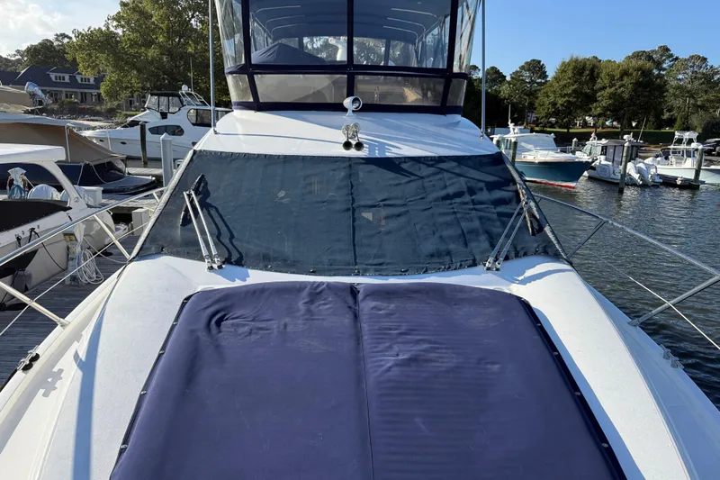 Seaya II Yacht Photos Pics 2008 Sunseeker Manhattan 50 yacht docked at marina, featuring covered deck and windshield.