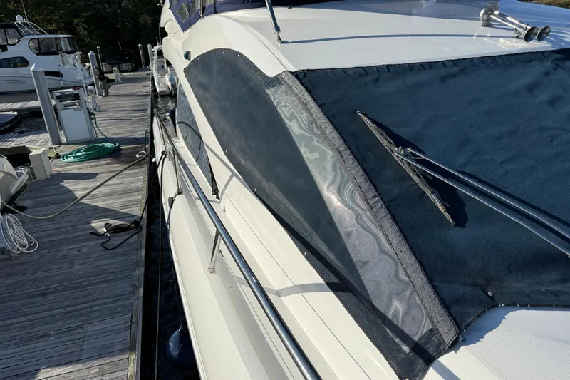 Seaya II Yacht Photos Pics 2008 Sunseeker Manhattan 50 yacht docked, showcasing sleek design and covered windows.