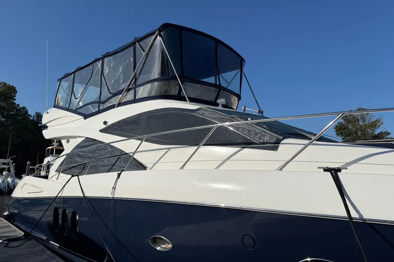 Seaya II Yacht Photos Pics 2008 Sunseeker Manhattan 50 yacht with sleek design, docked under clear blue sky.